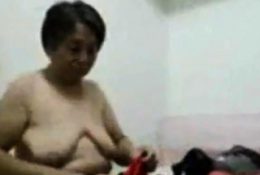 Asian Grandma get dressed after sex