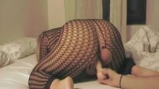 MILF in fishnets with dildo