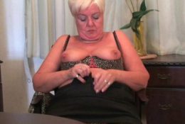 Highly sexed grandma Sandie rubs her pierced clit