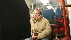 Young blonde girl can’t take her eyes of bulge in train
