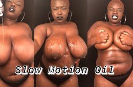 Slow motion BBW rubbing oil on big natural tits & body