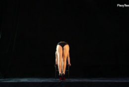Naked gymnast Kim Nadara doing gymnastics on chair